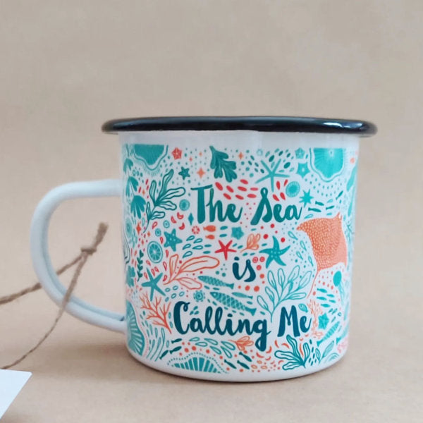 The Sea is Calling Me enamel mug is printed with illustrations by Fleur & Mimi, printed in-house in Co. Tipperary. This enamel mug is an ideal present for those that brave the cold waters for a swim, ideal for a post swim sipping a hot drink.