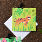 A greeting card of an adventurous tiger roaming through the jungle. Made in Ireland by Fleur & Mimi.